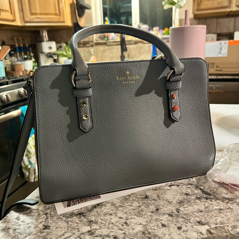 Baby blue Kate spade bag with cross body strap